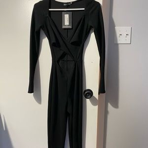 Black one piece jumpsuit, with cut out. Size 4/ S!